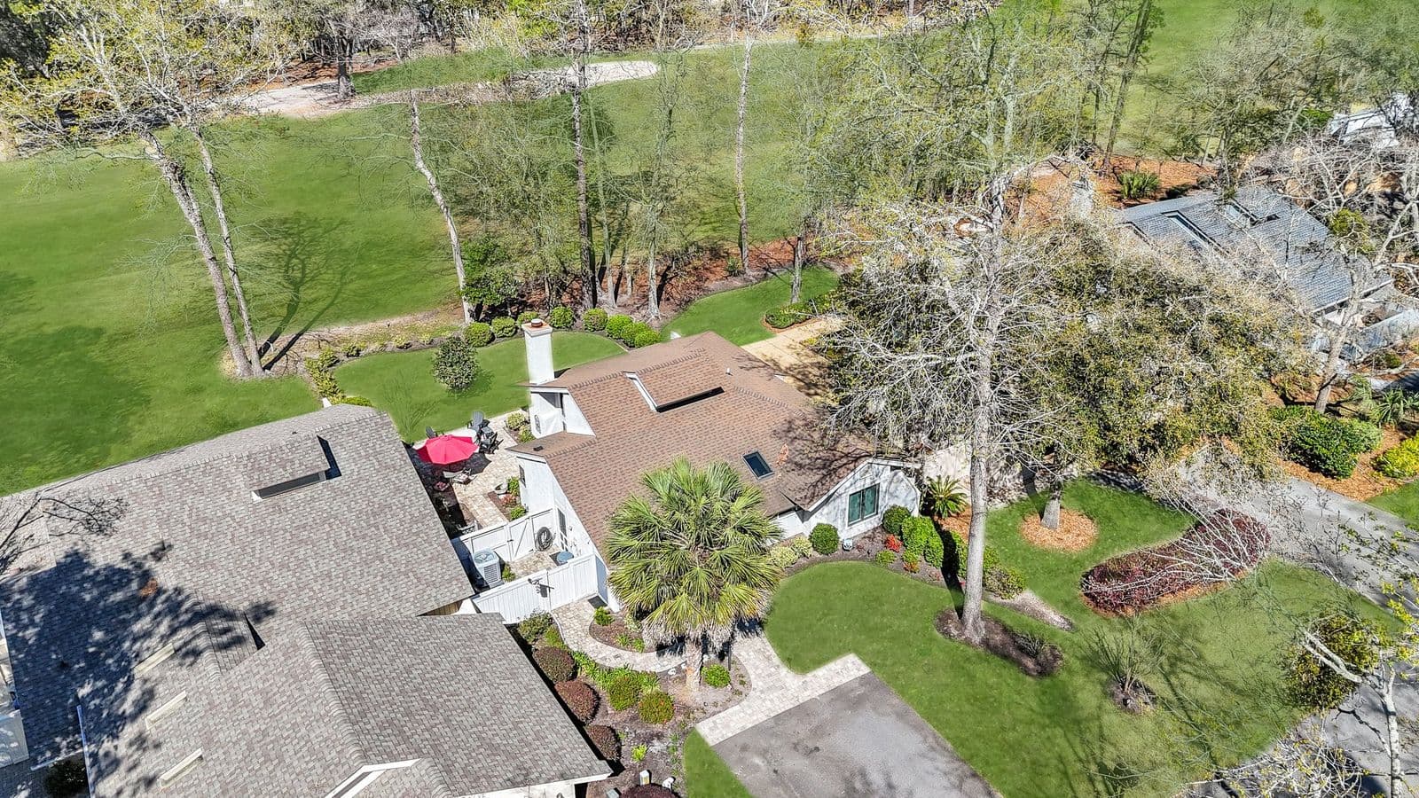 Aerial view looking down on a Moss Creek home and its garden